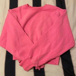 Pink TNA crop sweater from Aritzia